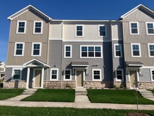 Modern design highlighted by stone accents & clean architectural lines. A charming front patio offers the perfect spot to relax, while the expansive windows fill the home with natural light.