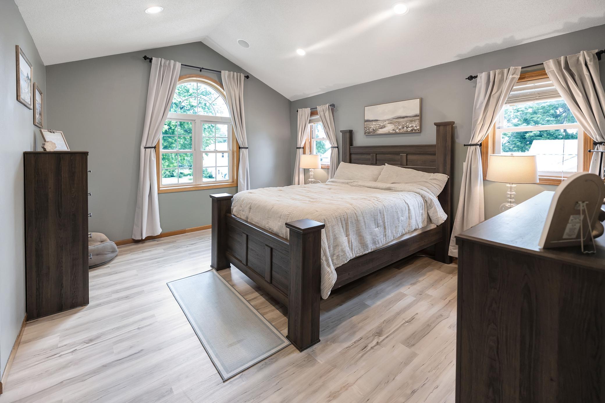First upper level bedroom with laminate flooring
