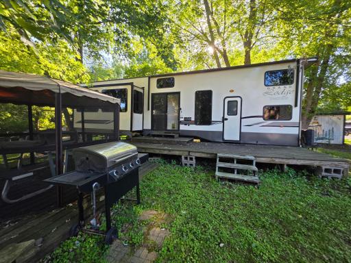 Grand Lodge includes Gazebo, deck, shed and huge unit within Cokato Lake RV Resort Cooperative Association
