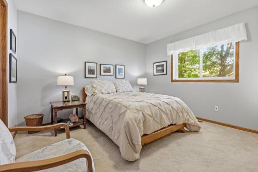 The primary bedroom is spacious-in and has a walk-in closet.