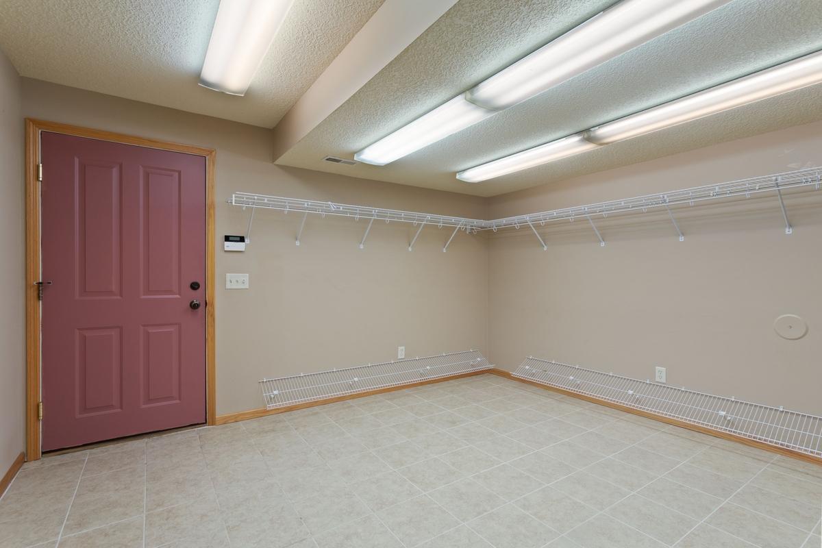 Lower level entry/mud room from heated 4 stall/shop