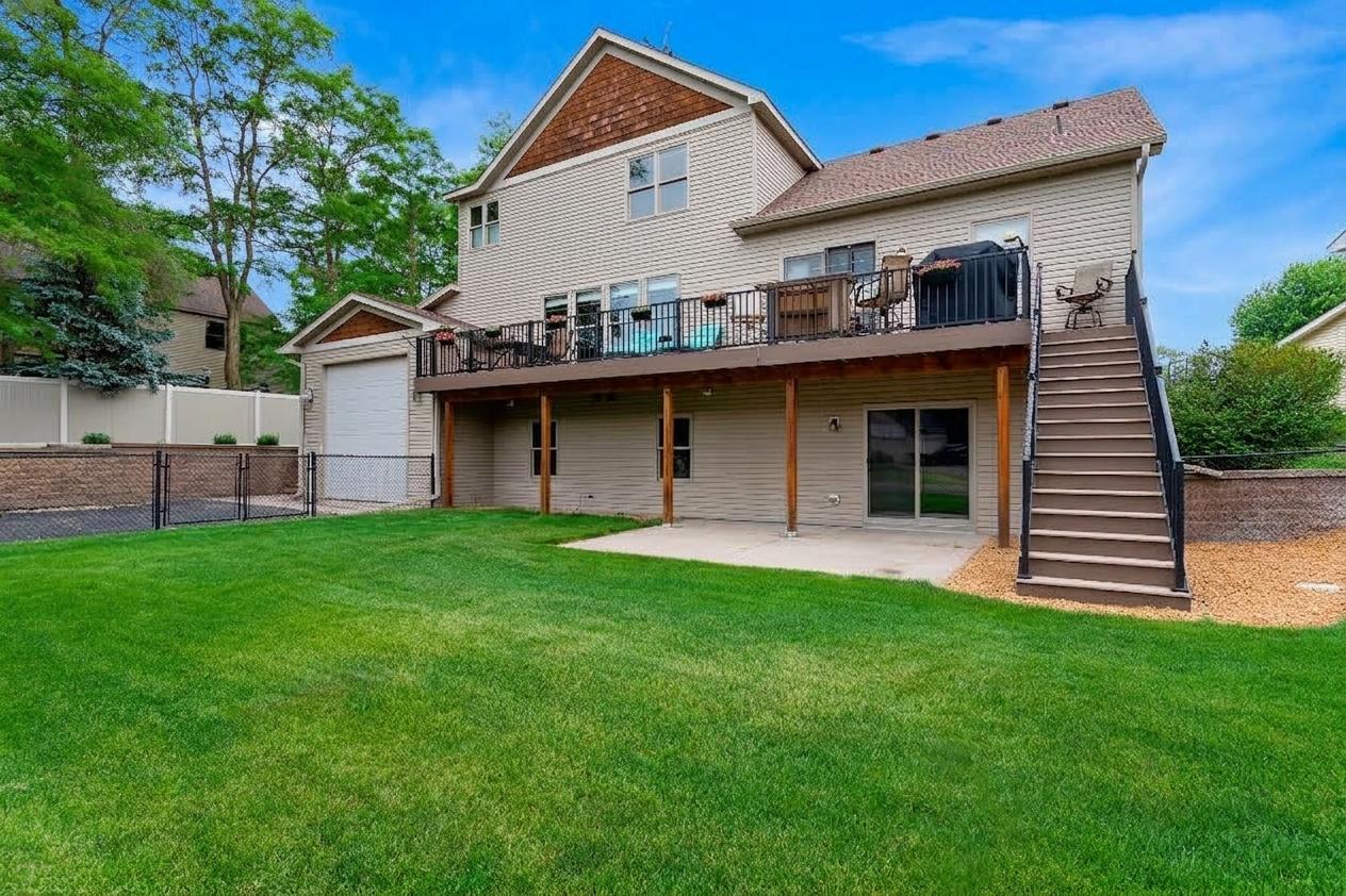 Rear walkout elevation notice the extra garage and maintenance free deck