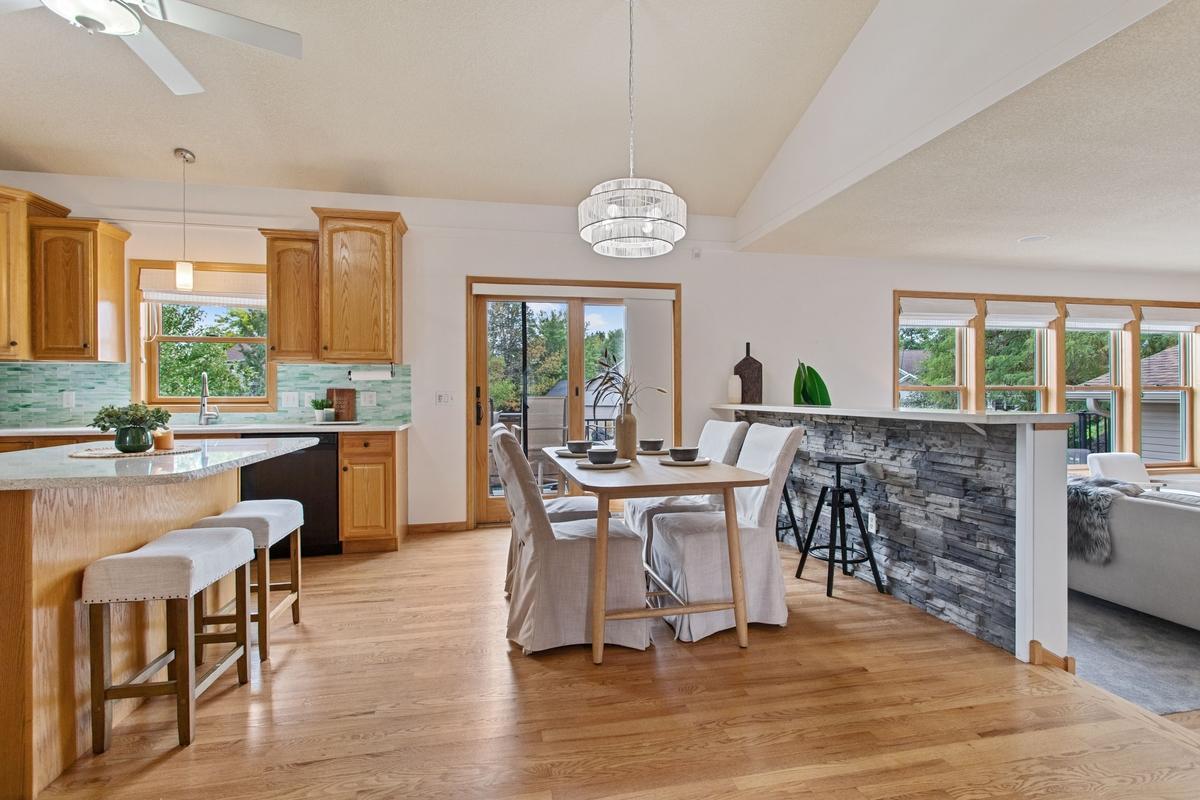 Solid oak hardwood flooring flows throughout main level