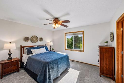 Upper level Primary Bedroom Suite overlooking the pond and park