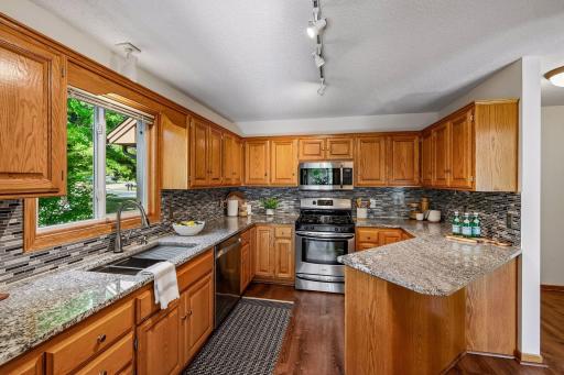 Plenty of storage and nice light in this special eat-in style kitchen