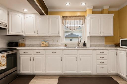 Main level kitchen offers lots of cabinet space.jpg