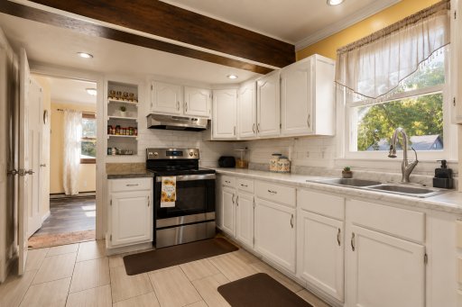Kitchen window offers natural sunlight with access to laundry room.PNG