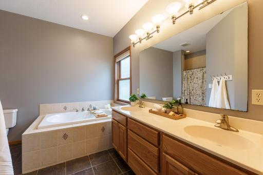 You'll appreciate the double sinks and tiled shower!