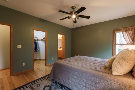 Primary bedroom on the main floor with large walk in closet and en-suite full bathroom.