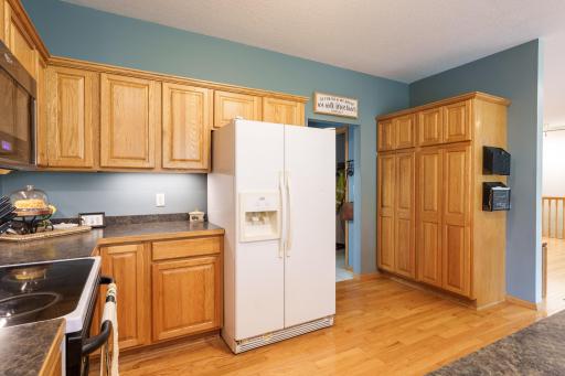 Check out that pantry cabinet! Doorway leads to laundry room, large coat closet & attached garage.