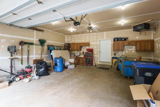 The attached two-car garage is insulated and heated.