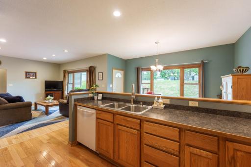 Bar-height counter creates an open connection between the kitchen and dining area