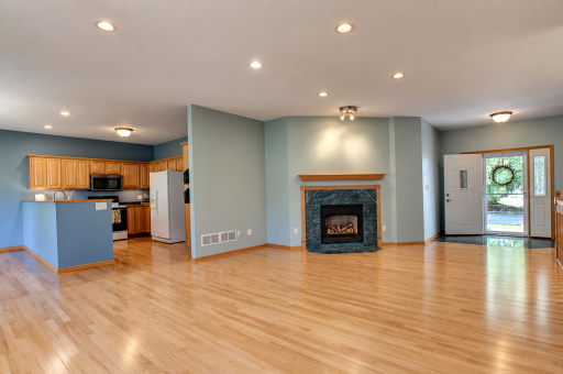 The front door opens to the spacious foyer and living room. The gas fireplace creates a cozy reading area.