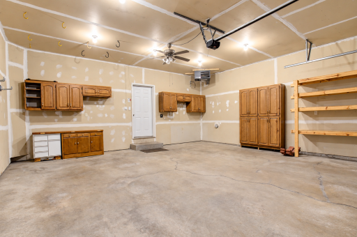 The attached two-car garage is insulated and heated.