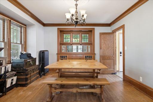 Formal dining room allows for all to gather for meals or entertaining. The built-in buffet gives additional display space.