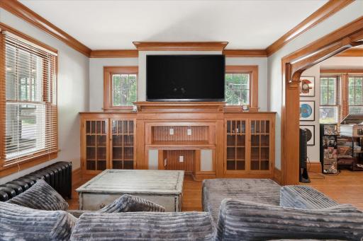 Built-in bookcases and display cabinets are the focal point of the living room.