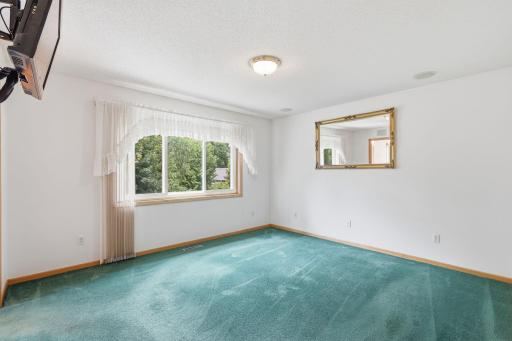 Upper-level owners suite overlooking private backyard