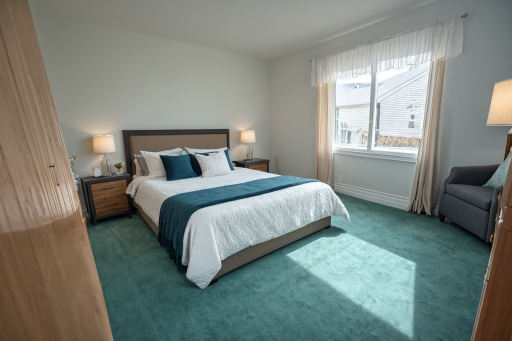 This photo has been virtually staged - upper-level 3rd bedroom