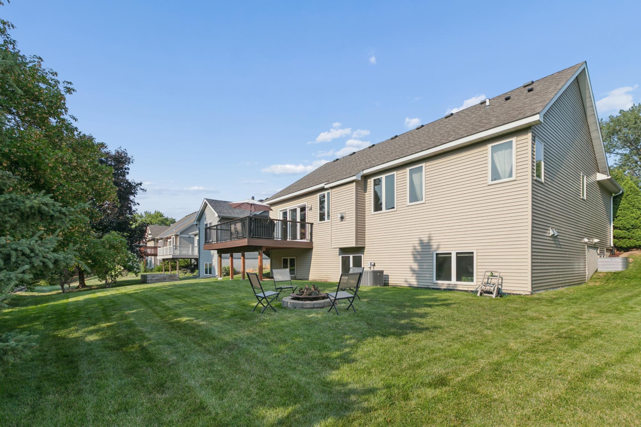 Low-maintenance landscaping, lush lawn and warm, south exposure.