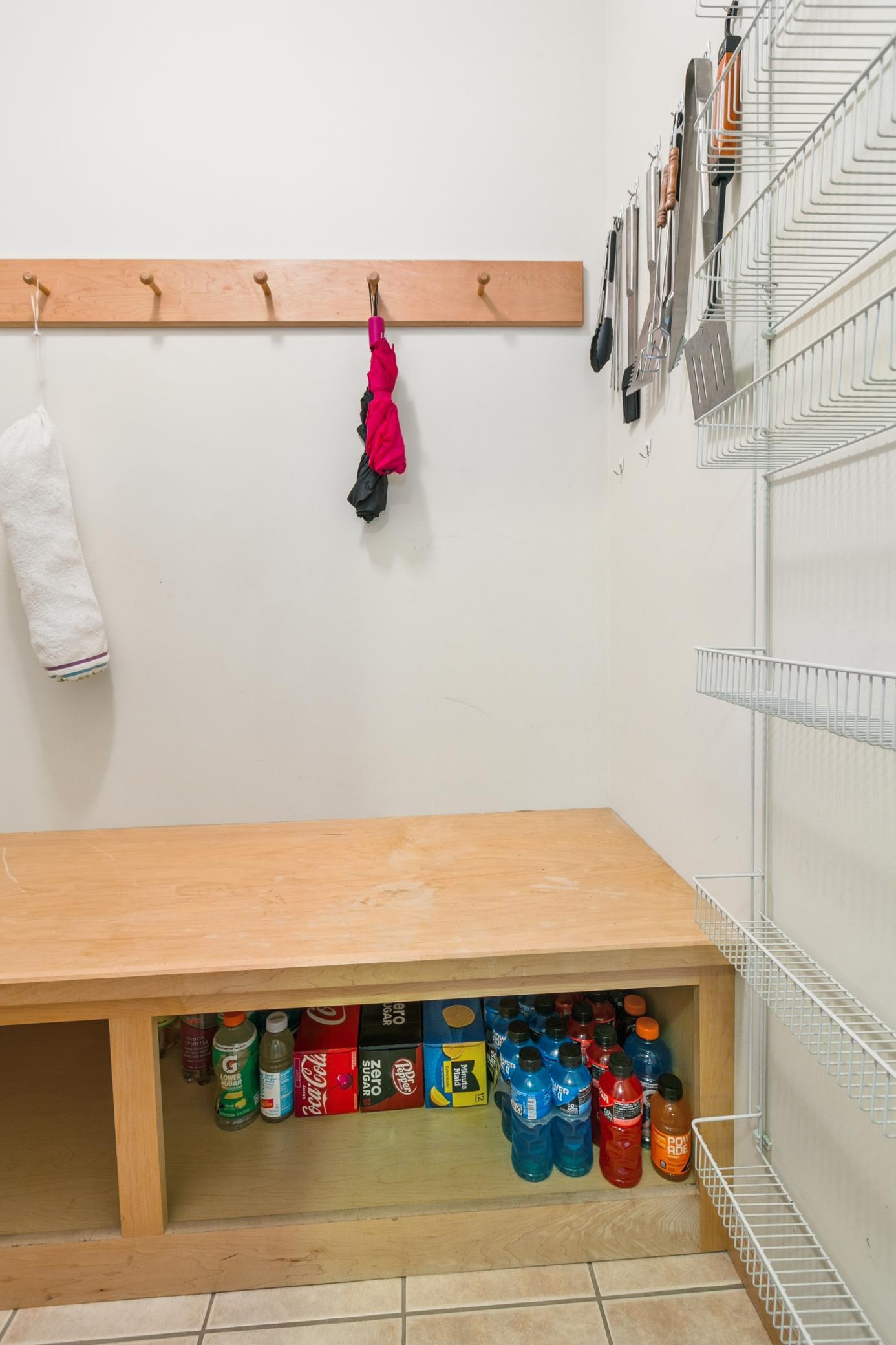 There is also a walk-in pantry/coat closet off the mudroom with even more space for household goods.