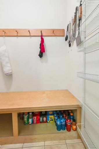 There is also a walk-in pantry/coat closet off the mudroom with even more space for household goods.