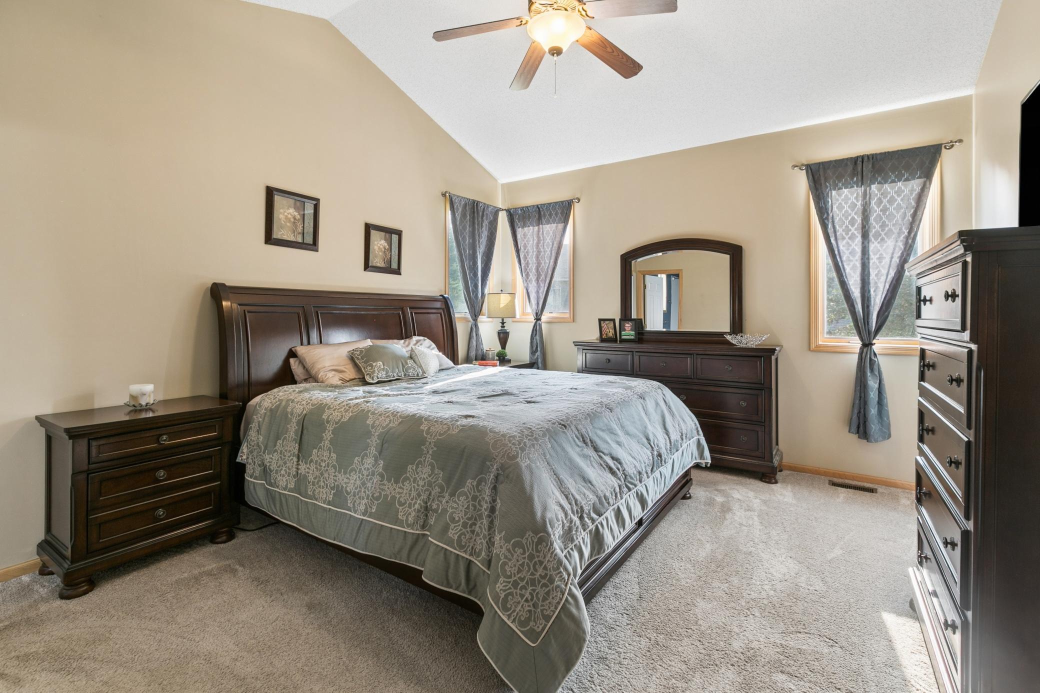 Spacious primary, main floor bedroom. YES: THAT'S A KING SIZE BED! Room accommodates all the pieces and still has great flow.