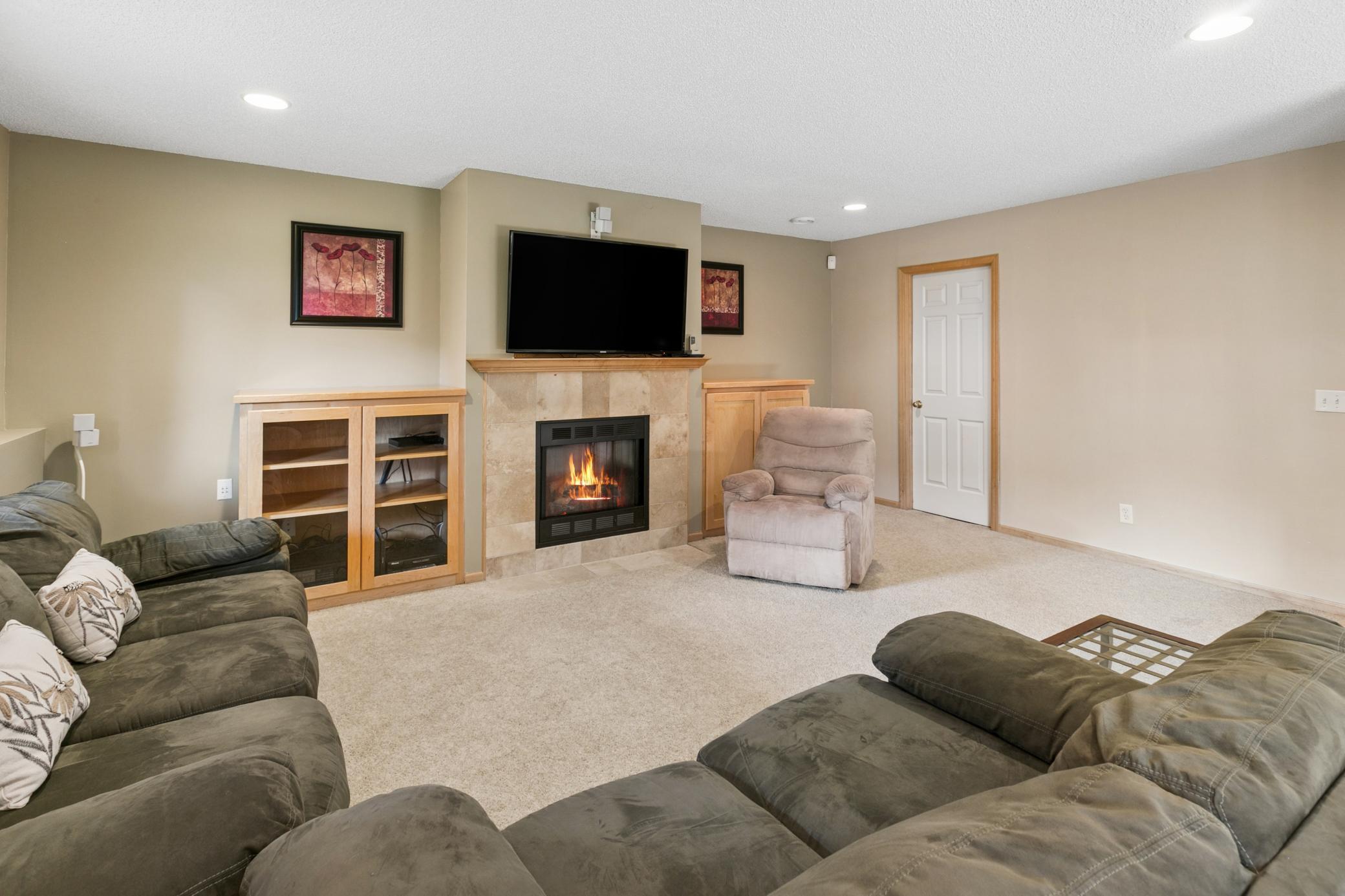 Built-in cabinets provide additional storage for electronics, games and toys.