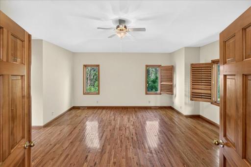 To the ride of the front entry lays the primary bedroom suite.