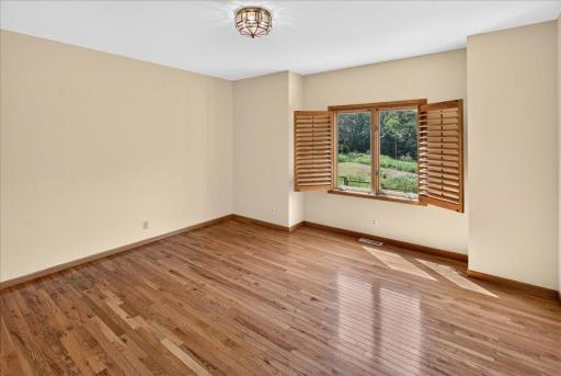 2nd bedroom on the main level with amazing views of the backyard oasis.