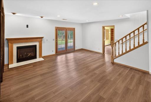 Gas fireplace for cozy winter nights and access to the gorgeous backyard space.