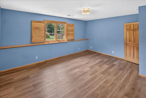 The bedroom overlooks the backyard.