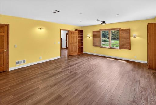 3rd bedroom downstairs. Extra spacious room overlooking the backyard.