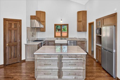 Beautiful updated kitchen with large center island providing tons of storage and an additional pantry.
