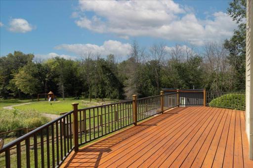 Walk out the dining room to your large deck with the most amazing views of your private backyard oasis.