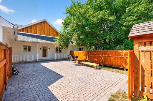 Large paver patio space to enjoy all summer long. Privacy all around.