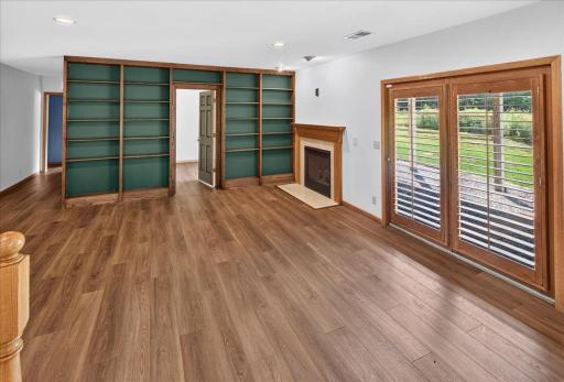 The lower level family room with tons of shelving to create a library feel.