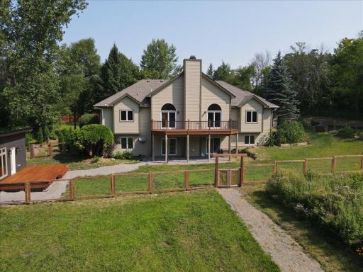 The immediate yard space around the house leads to a custom built sauna added in 2026.