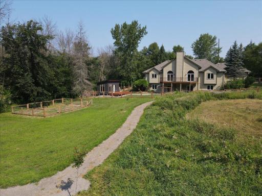 Enjoy the walking path throughout your large backyard all the way to the creek.