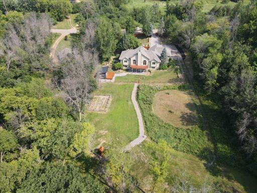Phenomenal lot backing up to Painter Creek and offering a the most amazing spaces to for nature lovers, gardeners, sauna lovers, nature enthusiast and the young and young at heart to play in.
