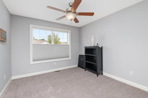 Third bedroom with large windows and ceiling fan. Nice space for a home office or den!