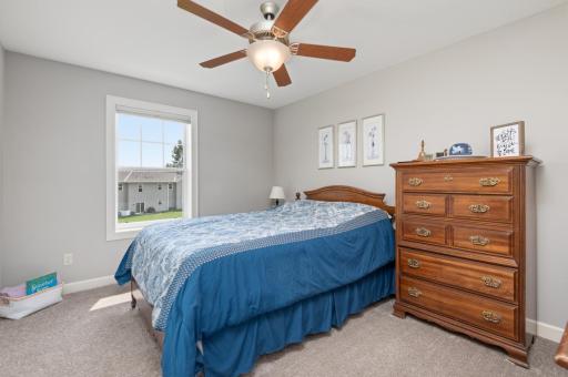 Second upstairs bedroom with a ceiling fan and window facing the courtyard. All the rooms have high quality room darkening blinds.