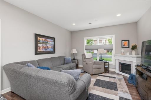 Step in to the main level living room with recessed lighting, knockdown ceilings and new LVP flooring. Custom blinds here too!