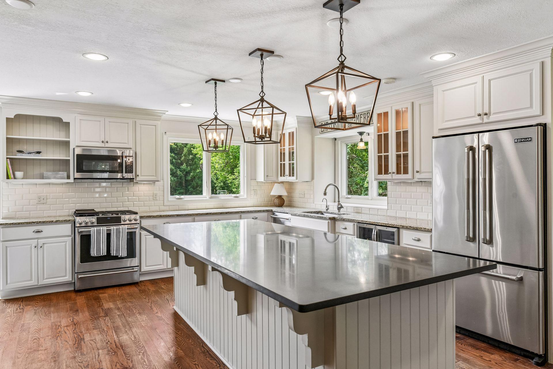 Beautiful pendant lighting, granite counters and space to create!