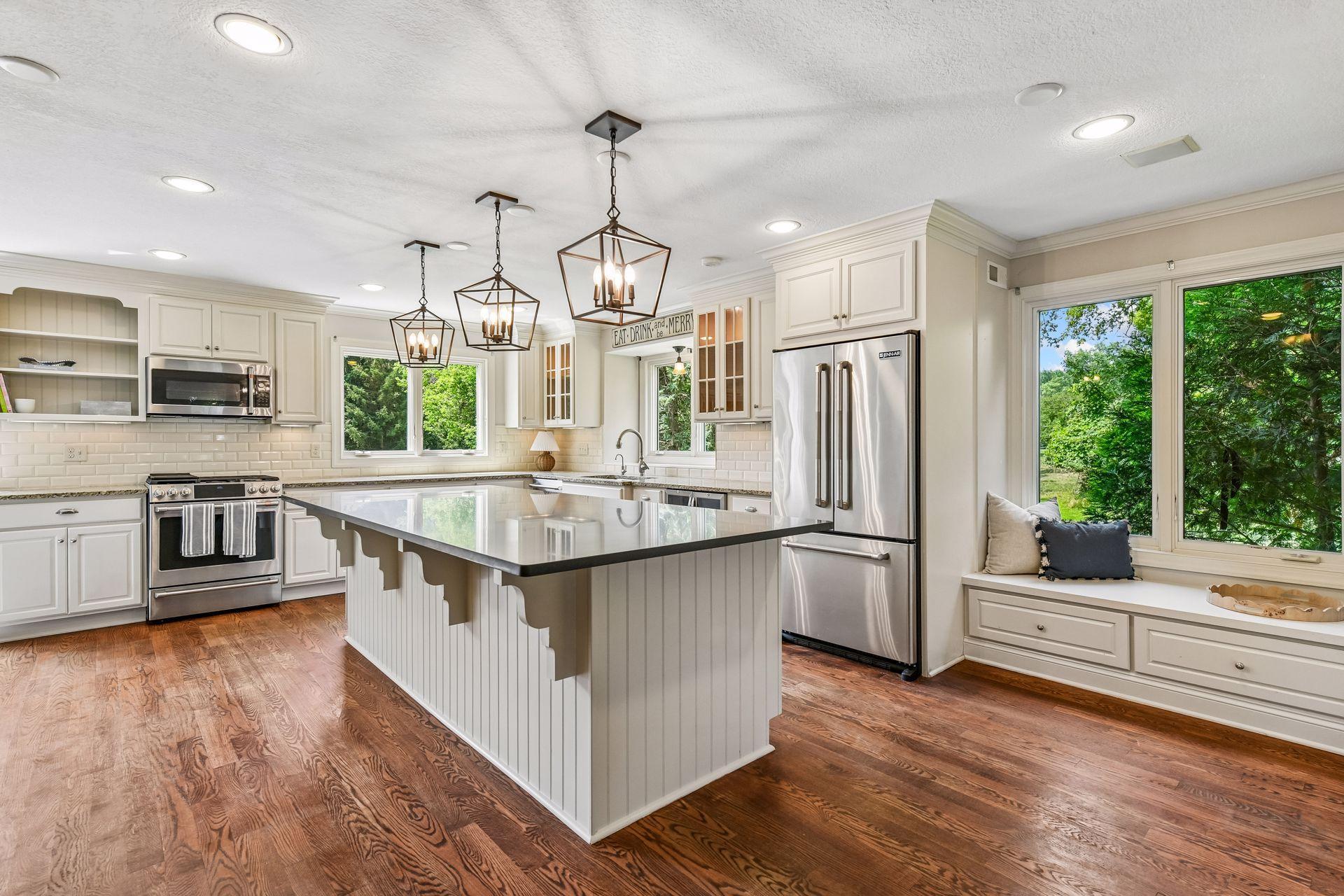 Large center island/breakfast bar and charming window seat