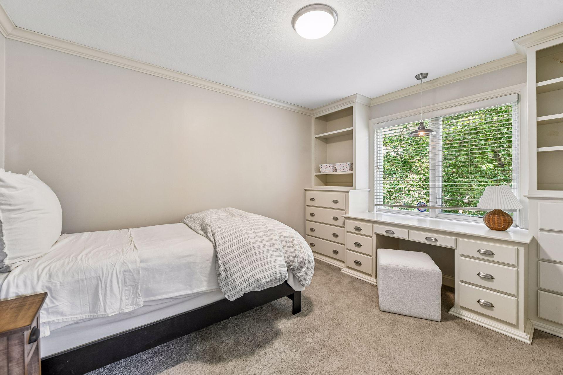 Upper-level Bedroom 2 with built-ins