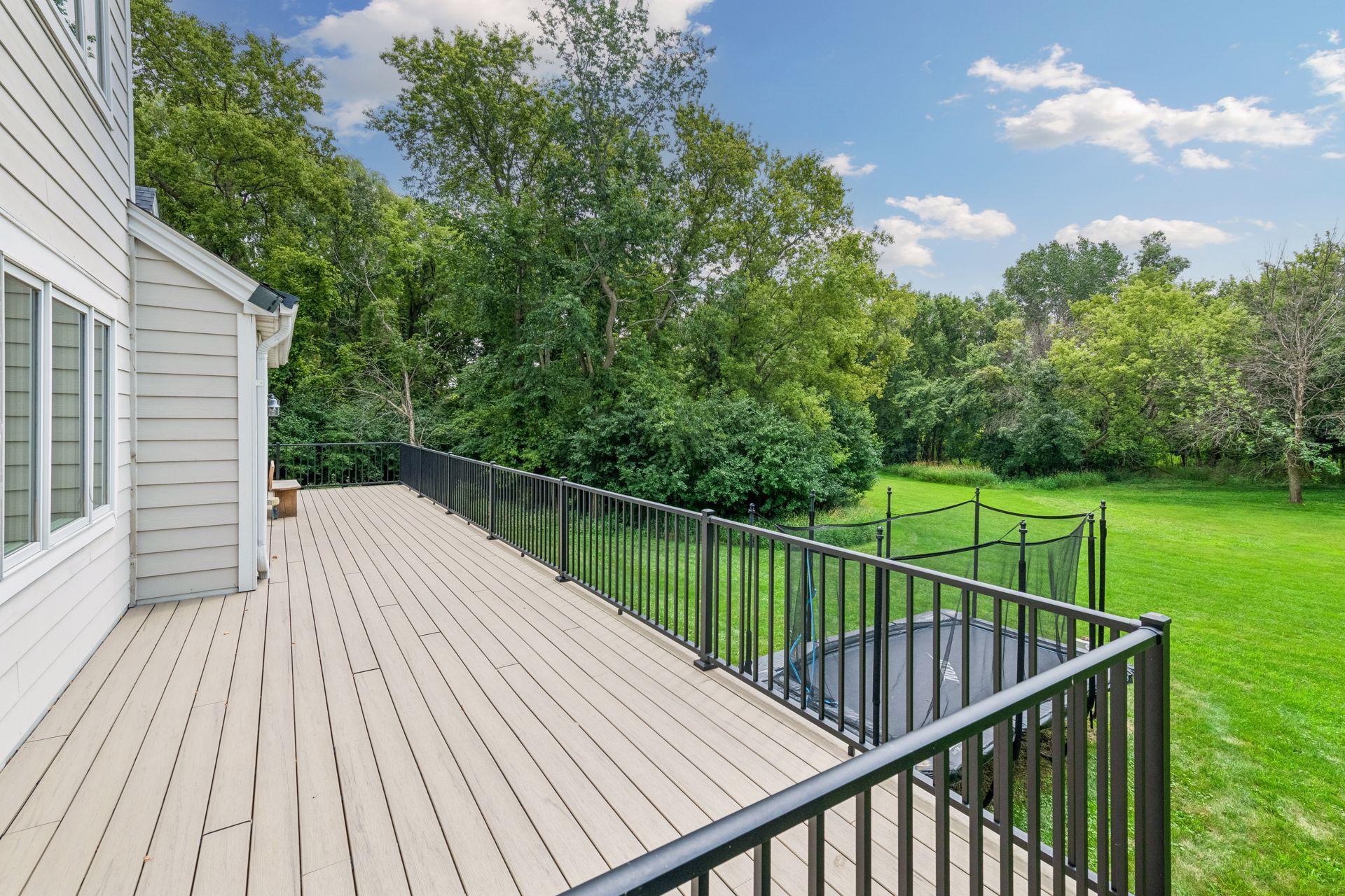 Expansive deck overlooking the gorgeous backyard