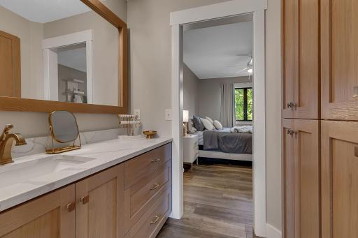 A look at the second upstairs bedroomâs private vanity area, providing a dedicated space to get ready with convenient access to the shared Jack-and-Jill bathroom.
