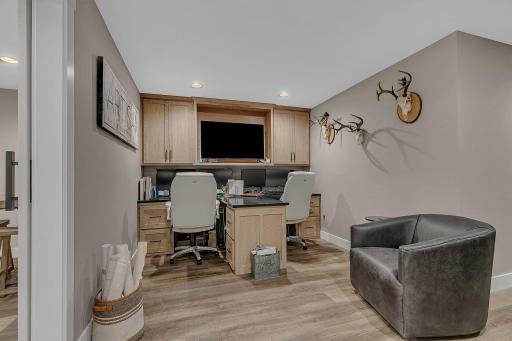 A dedicated office space with built-in desks and shelving provides the perfect setup for working from home, staying organized, and getting things done.