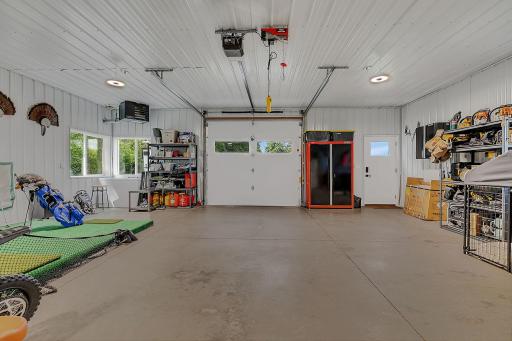 The garage door on the outbuilding provides easy access for a variety of vehicles, recreational equipment, or other toys you want to keep safely indoors.