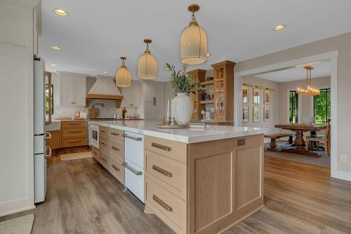 A beautiful view of the kitchen, thoughtfully designed to overlook the formal dining room.